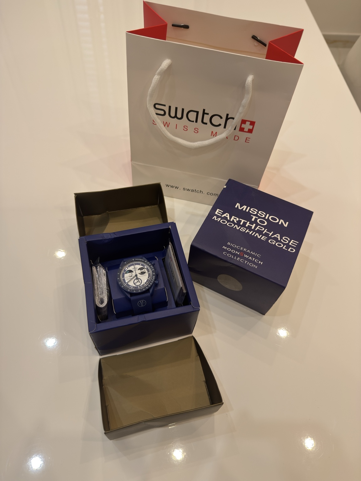 Omega X Swatch — Mission to the Earthphase Moonshine Gold
